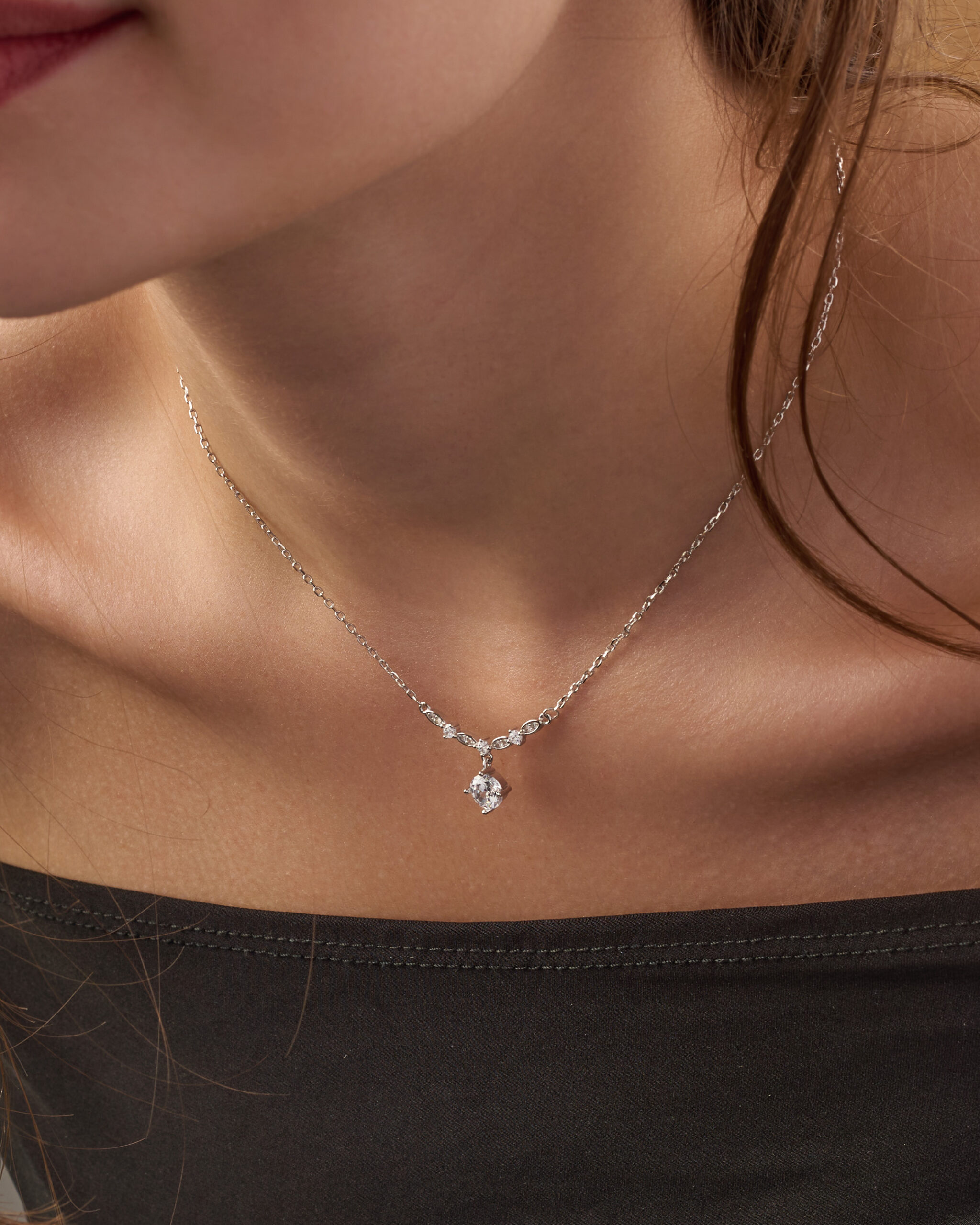 Simple silver pendant in the shape of a circle, inlaid with white zircon stones. - Image 3